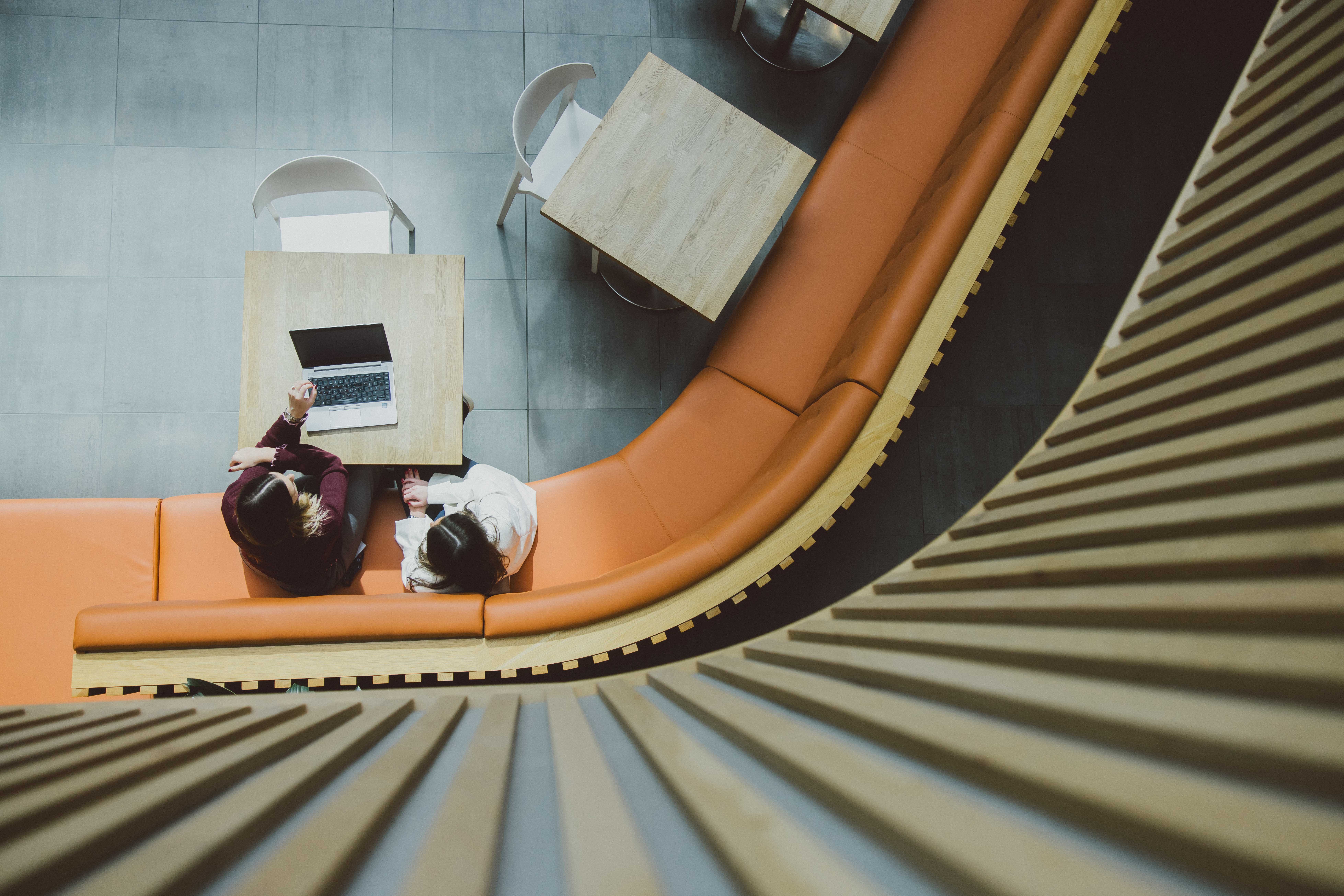 Two colleagues talking in a law firm office